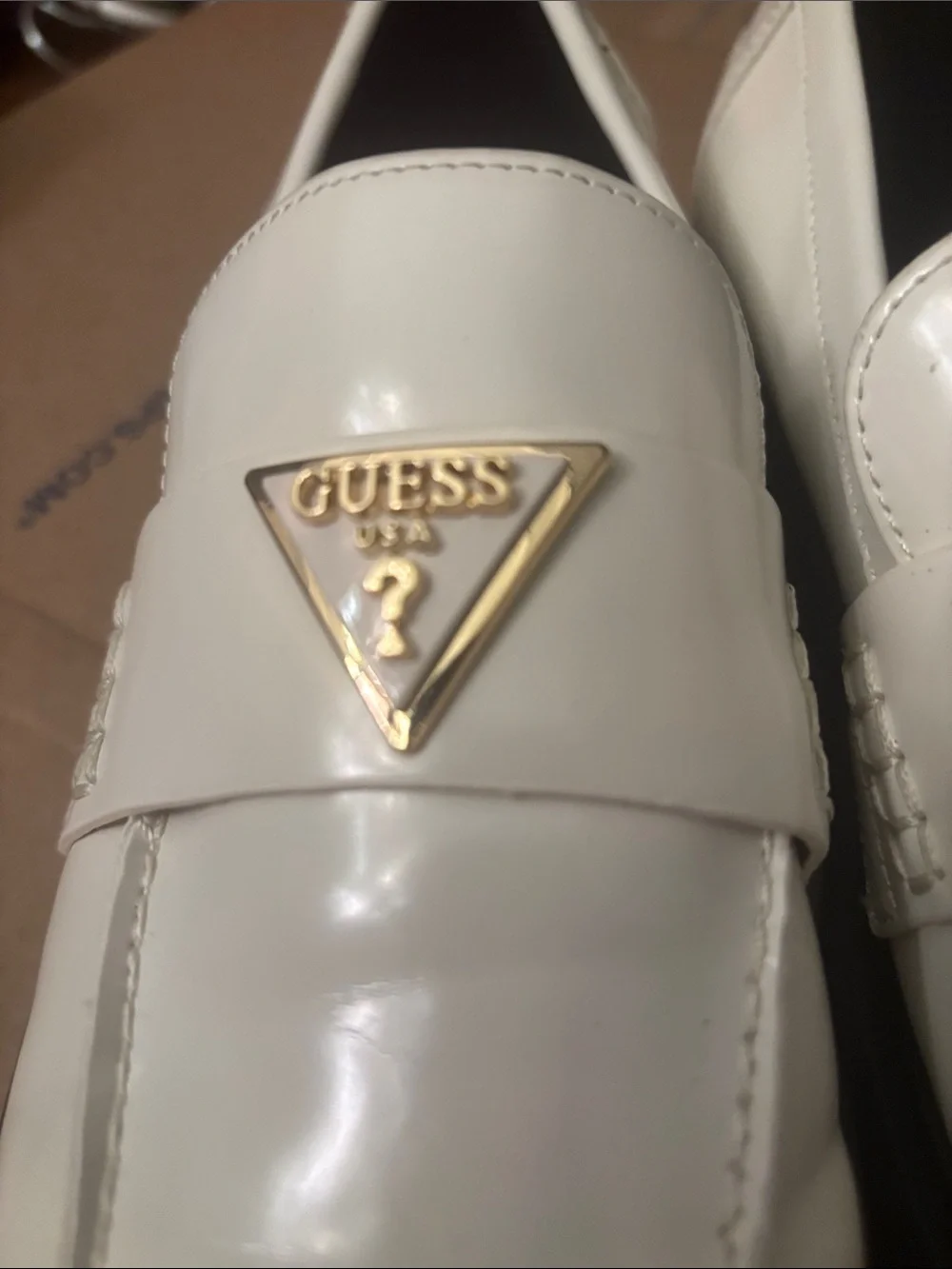NWOT Guess White Slip-On Penny Loafers with Gold Triangle Logo
